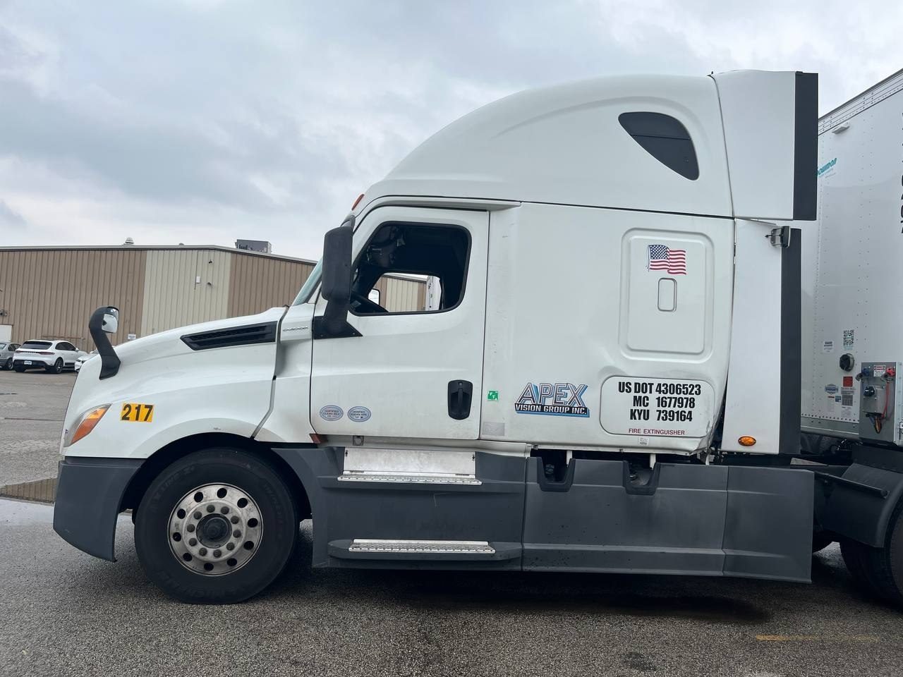 Apex Vision Group tractor showing the sleeper and DOT markings.