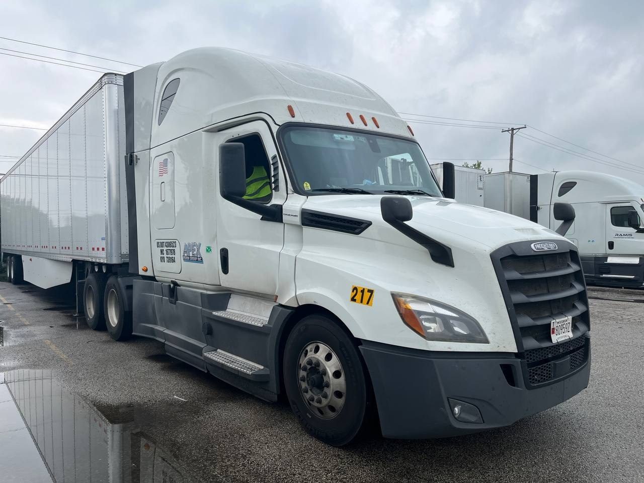 An Apex Vision Group Freightliner Cascadia coupled to a 53-foot dry van.